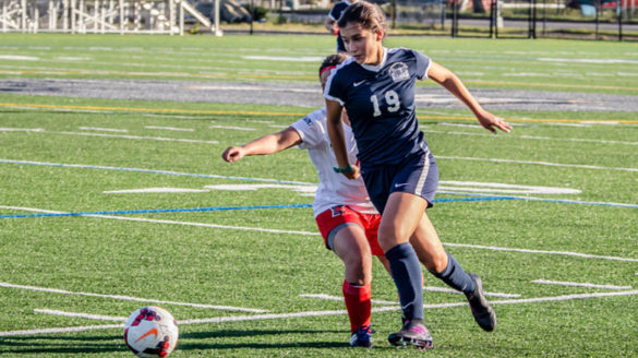 Female playing soccer.