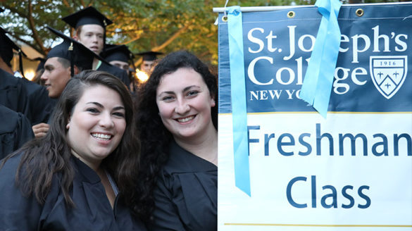 Freshman students smiling at investiture.