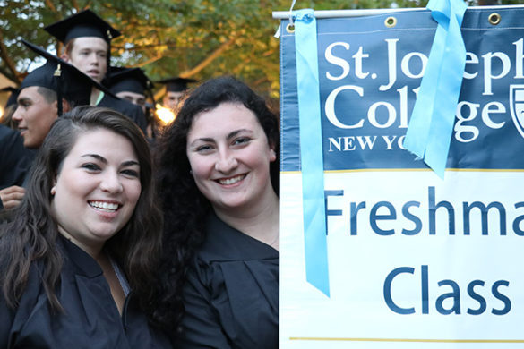 Freshman students smiling at investiture.