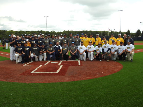 SJC long island baseball alumni posing on the baseball field.