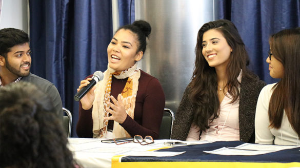 Female student speaking into a microphone.