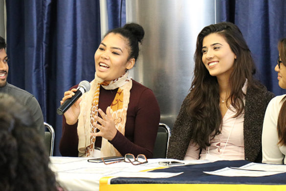 Female student speaking into a microphone.