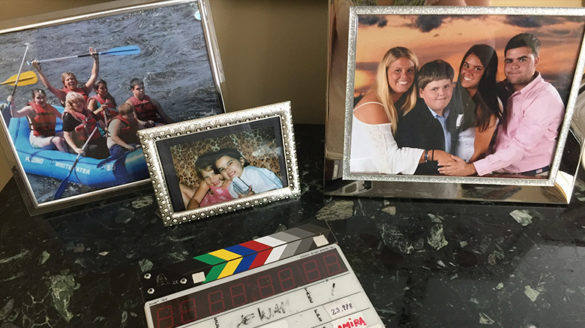 Family photographs sitting on a table.