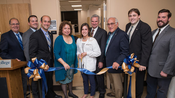 People attending a ribbon cutting ceremony at SJC.