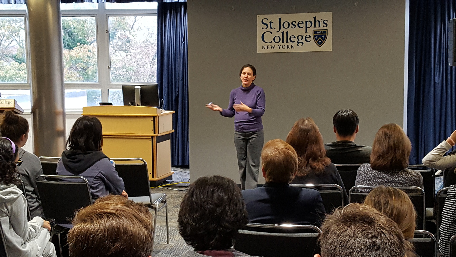 Deborah Horan speaking during a common hour event at SJC Long Island.