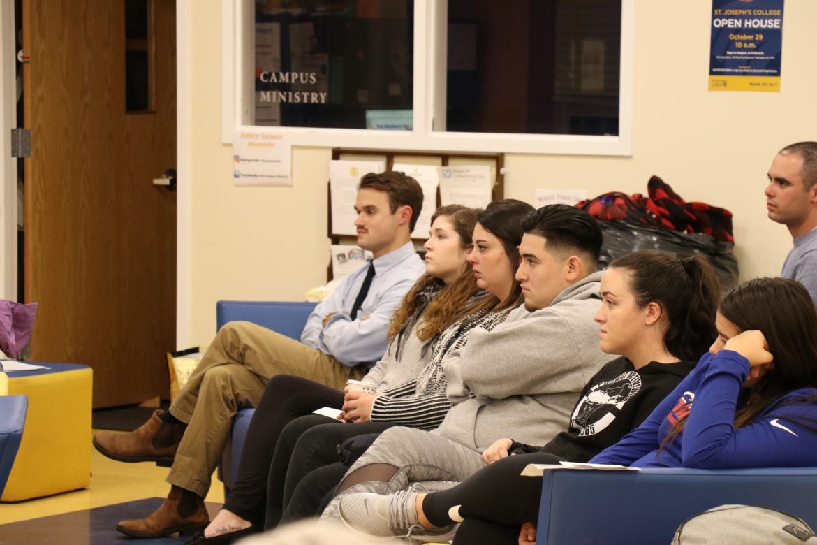 People attending a memorial service, seated.