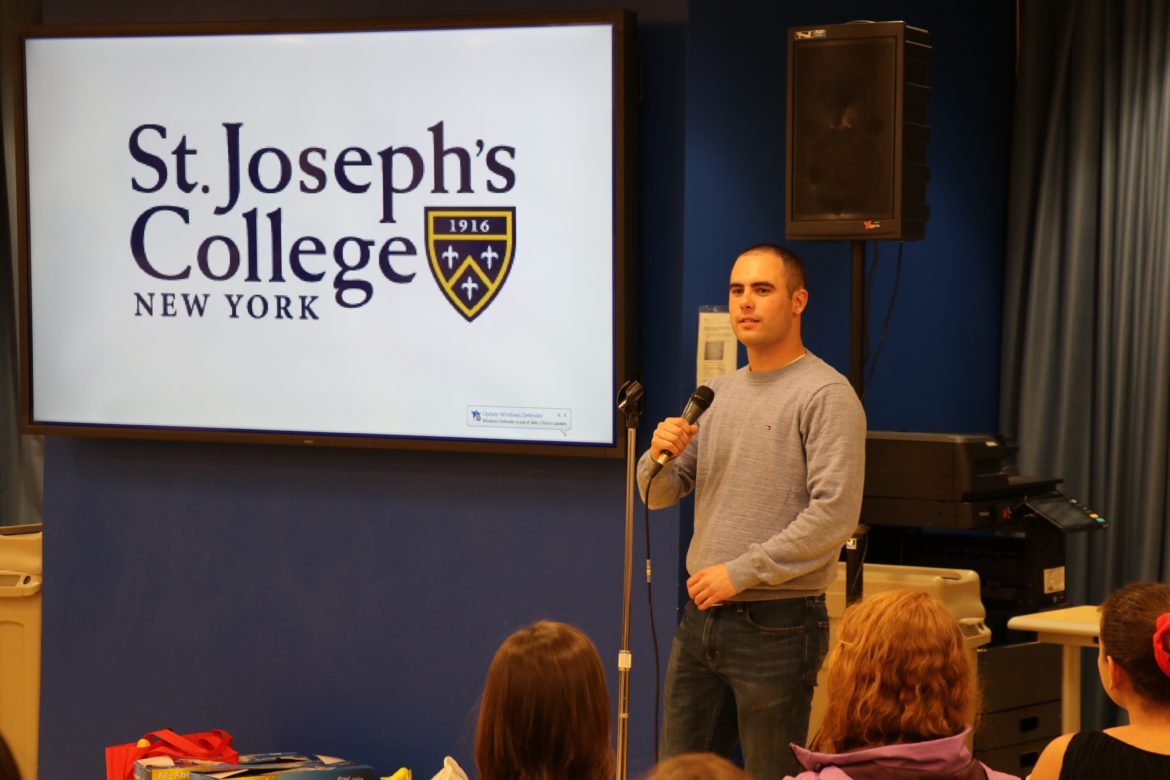 Man speaking into a microphone.