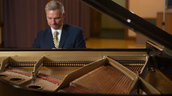 SJC President Boomgaarden playing the piano at SJC Brooklyn.