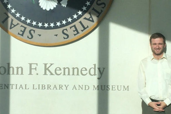 Newman Fellow Student standing at museum