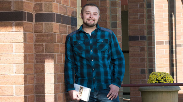 Nicholas Bates in front of the Callahan Library