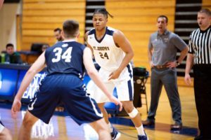 Two basketball players in action. 