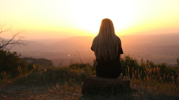 Girl watching sunset.