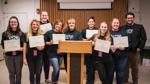 SJC students in the Voices from the Inside course alongside the faculty who led the course.