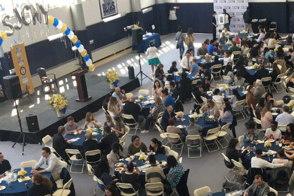 Overhead shot of students seated at tables.