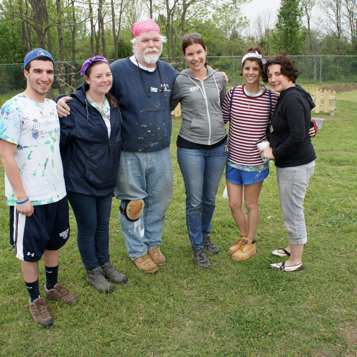 Pat Tracy with SJC students during a service trip.