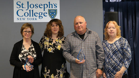 Pat Tracy's family accepting the award in his honor.