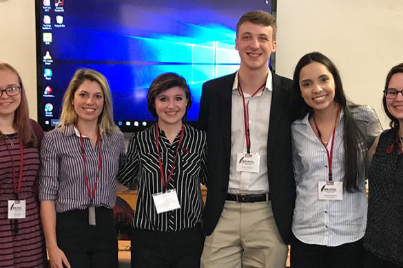 Seven SJC students at the New Critics Conference.