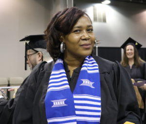 Woman graduating with masters degree. 