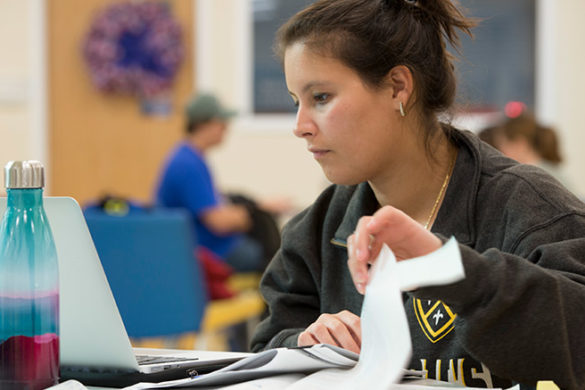 SJC student working on her laptop.