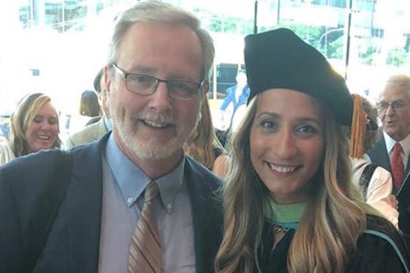 Two adults at a graduation.