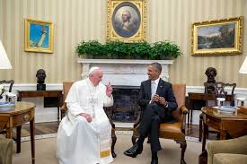 Pope and Obama seated.