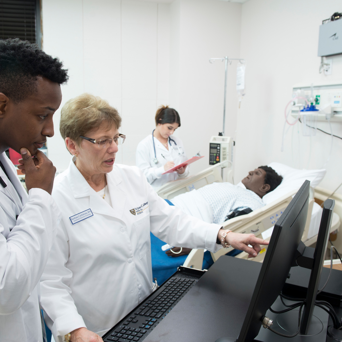 Nursing students working with new technology in SJC's updated nursing labs.