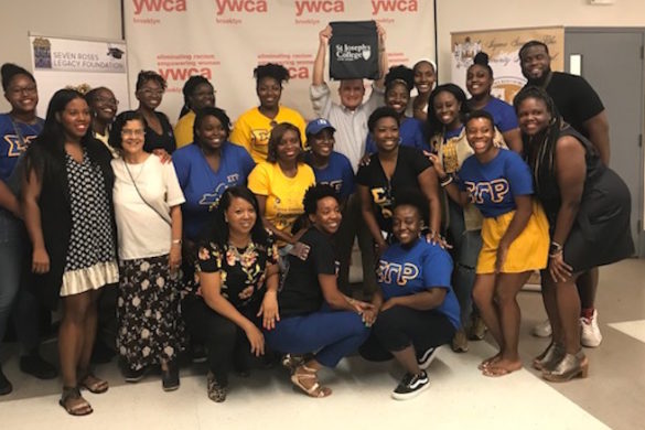 Group of people posing for photo.