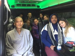 Students on bus with teacher.