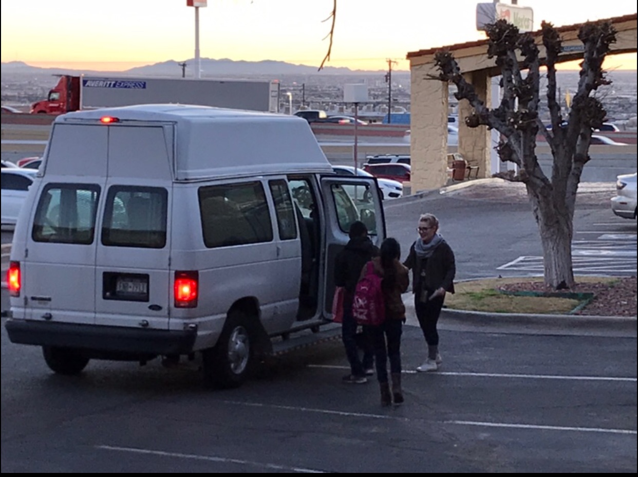 Kaleigh Burke ’18 helping refugees travel to their next location.