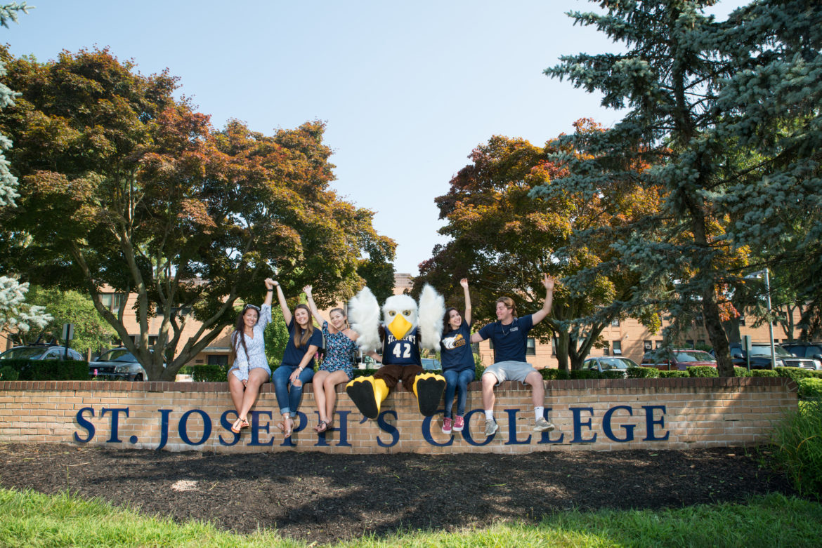 LI mascot with students.