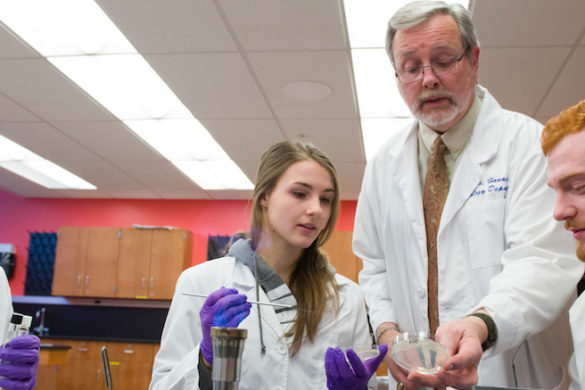 Teacher and students in science lab.