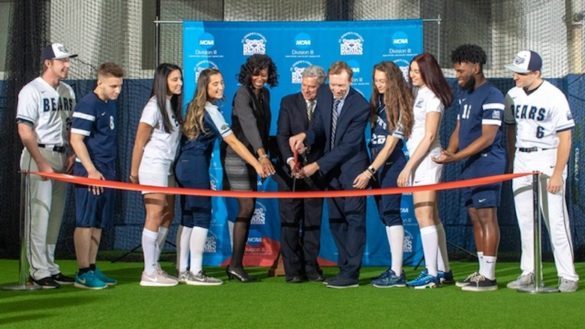 Administrators and students at ribbon cutting ceremony.