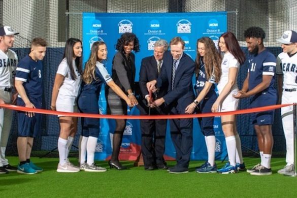 Administrators and students at ribbon cutting ceremony.