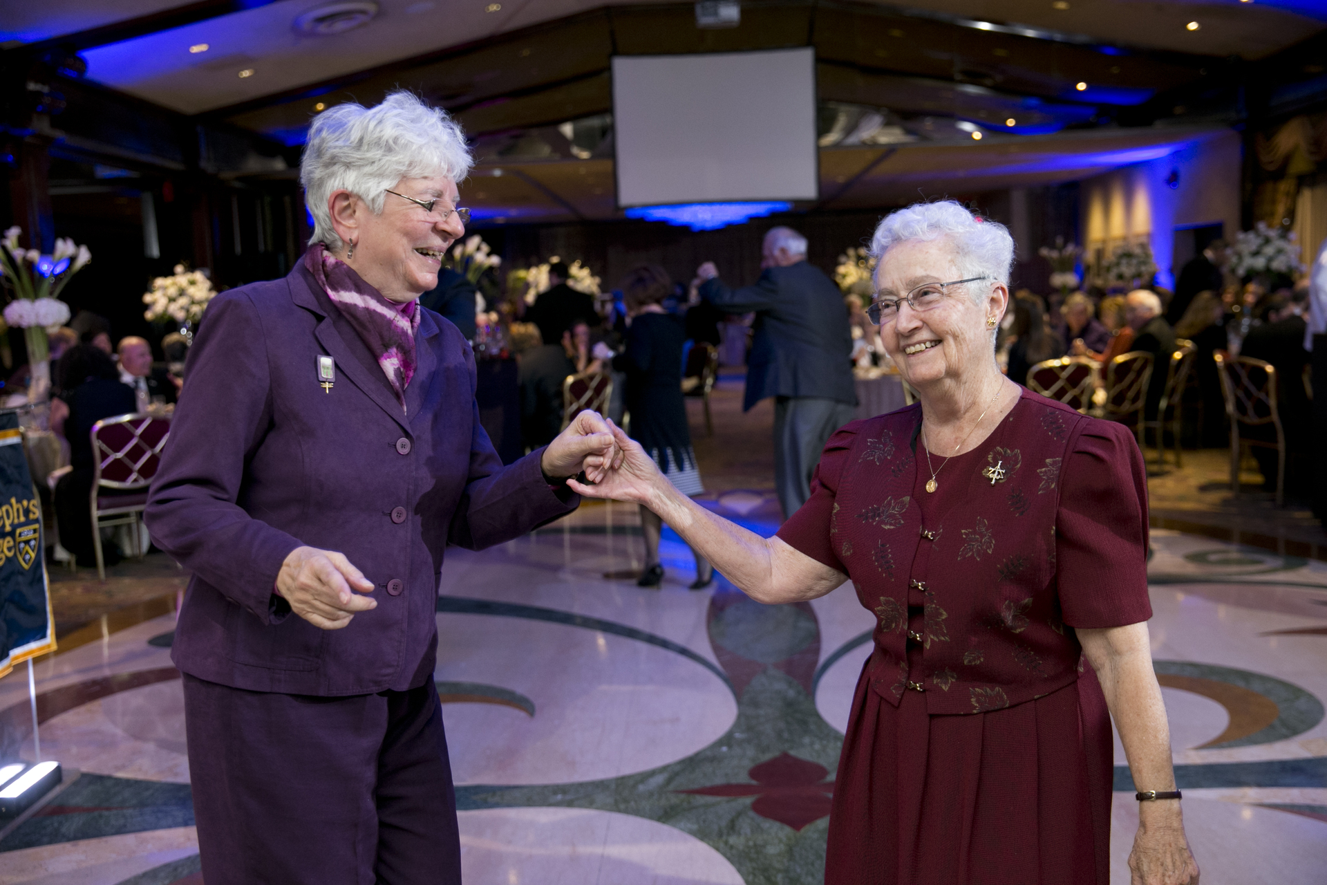 S. Mary Sivillo dancing at a scholarship gala