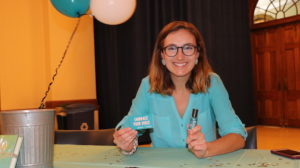 Woman at table for Sexual assault awareness