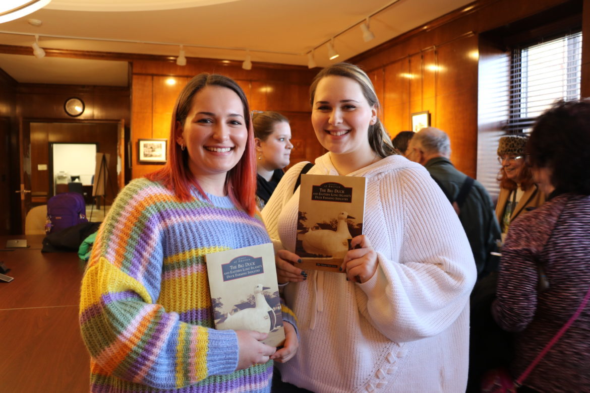 Students holding their signed books.