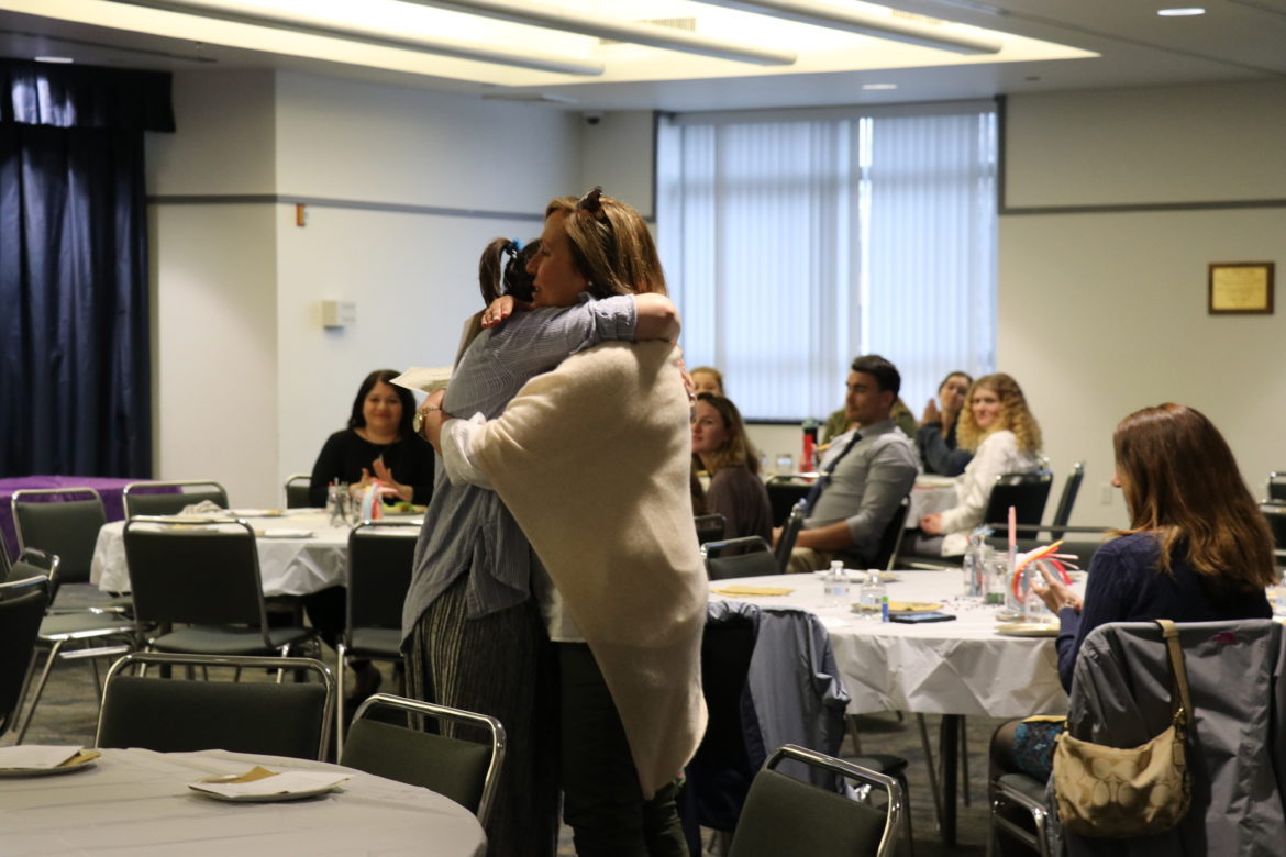 Student hugging her cooperating teacher.