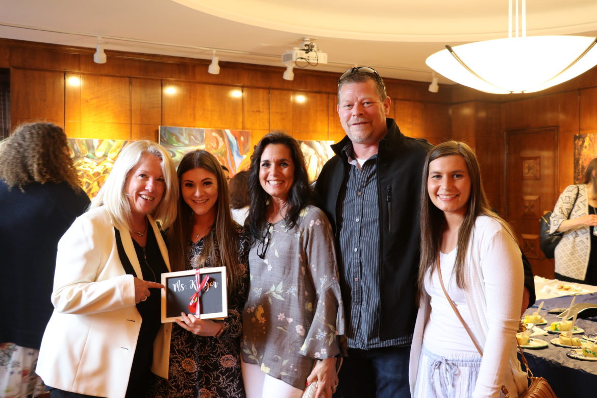 SJC Long Island student with her parents and professor.