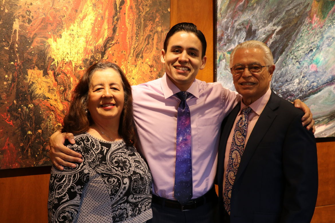 SJC Long Island student with his parents.