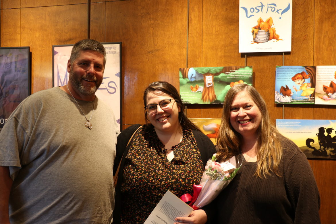 SJC Long Island student with her parents.