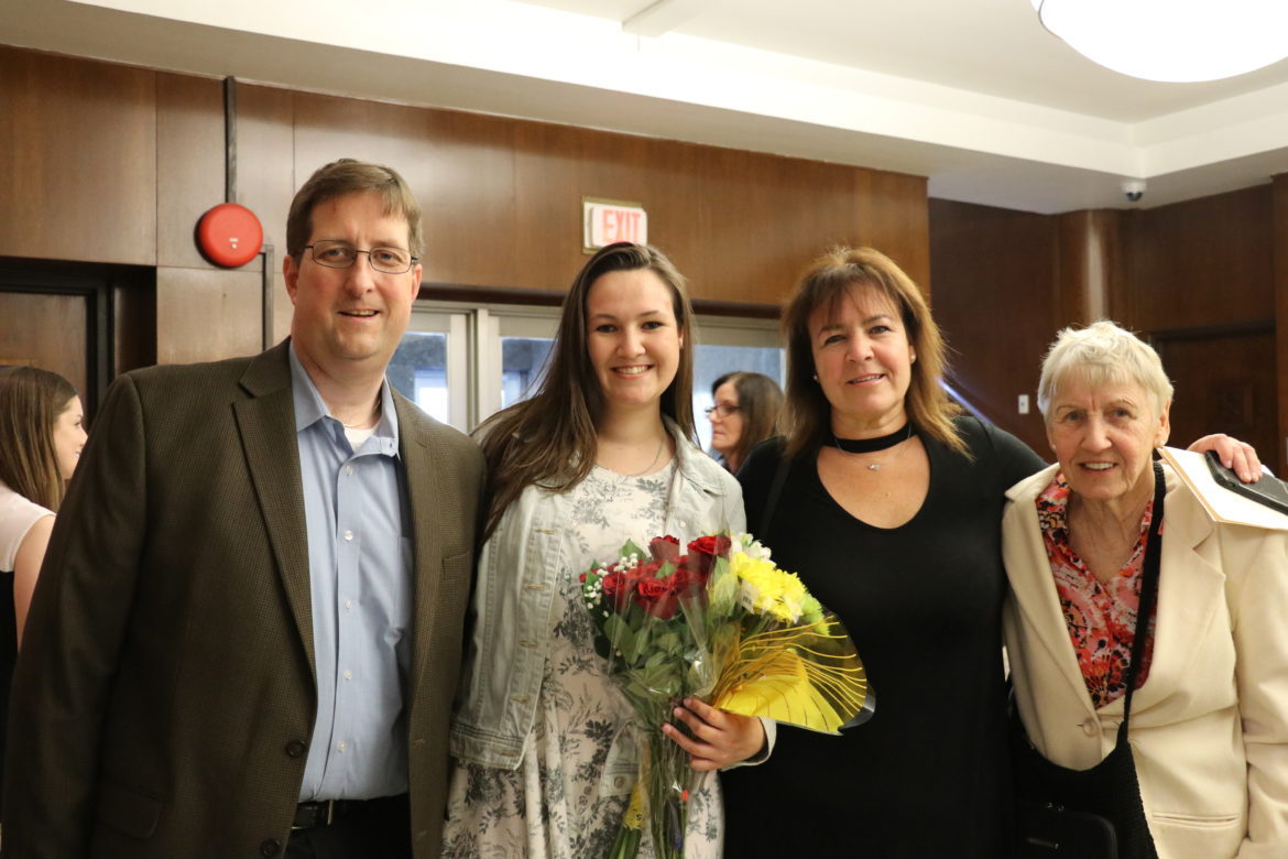 SJC Long Island student with her family.