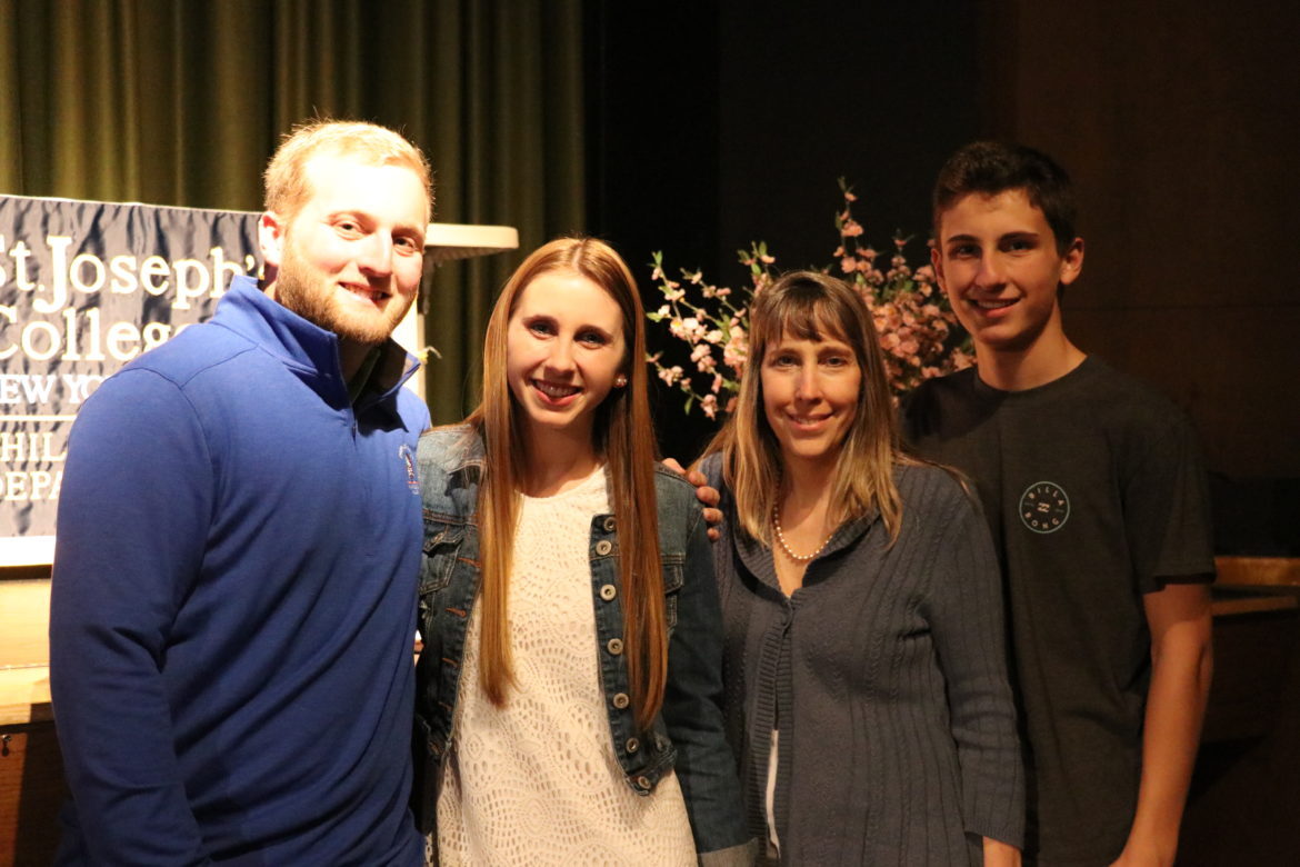 SJC Long Island student with her family.