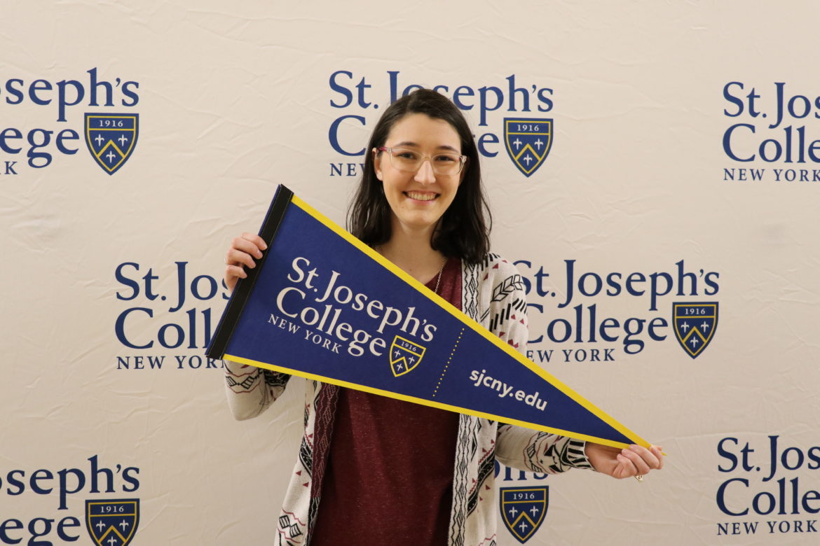 SJC Long Island senior at Cap and Gown Pickup in 2019.