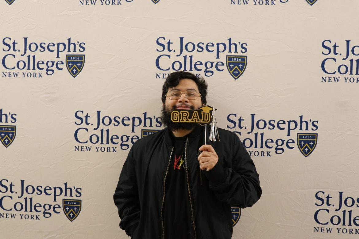 SJC Long Island senior at Cap and Gown Pickup in 2019.