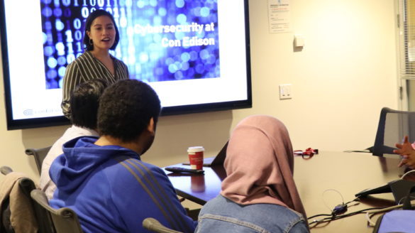 Instructor talking with students.