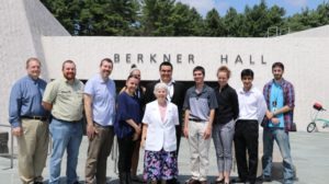 Group standing in front of meeting hall.