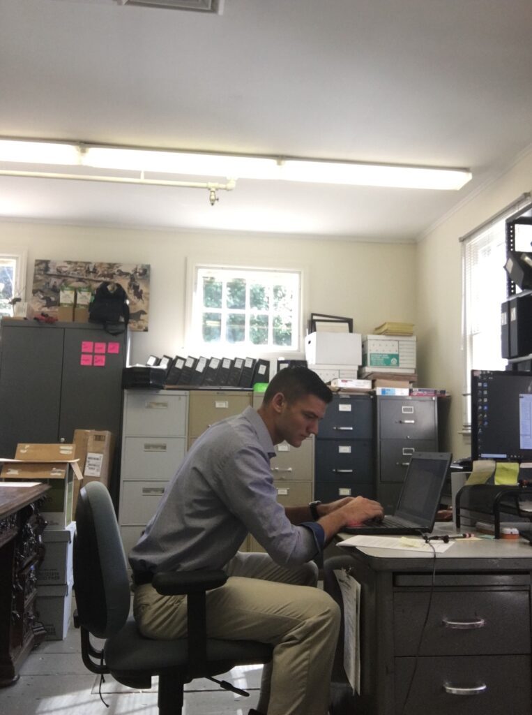 Sean Murray at the Long Island Museum creating labels for a recent accession of photographs.