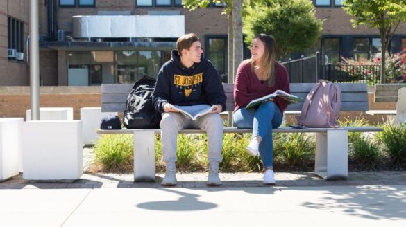 Two students talking at SJC Long Island.