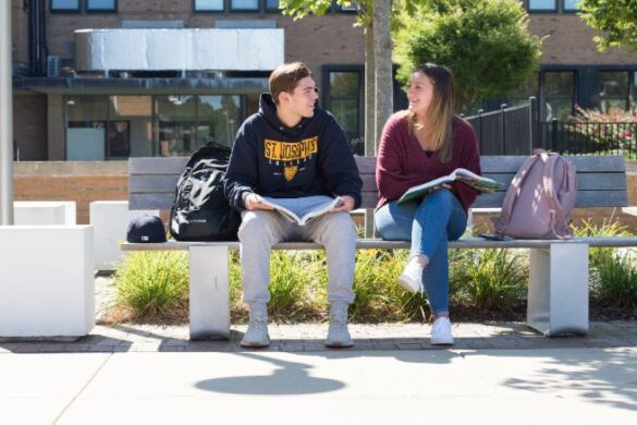 Two students talking at SJC Long Island.