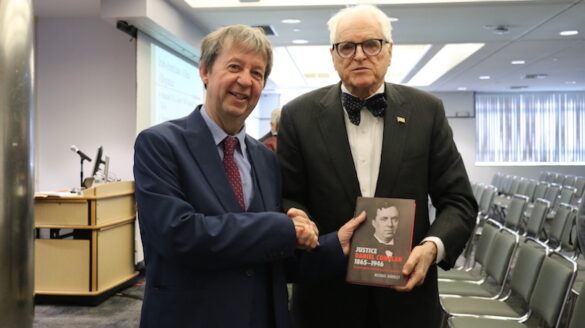 Dr. Doorley shaking hands with Judge Peter Fox Cohalan.